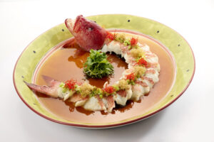 Tender garoupa fillet steamed with garlic, ginger, spring onions and soy sauce