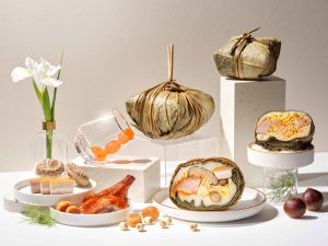 Li Bai Cantonese Restaurant Traditionally Steamed Cantonese Rice Dumpling — lotus leaf wrapped guo zheng zong cross-section with pork belly, salted egg yolk and mushrooms, Singapore